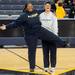 Measie James and Cathy Wilczynski, both of Ann Arbor, goof around as they have their photo taken at half court during an open house at Crisler Arena on Friday evening. Melanie Maxwell I AnnArbor.com